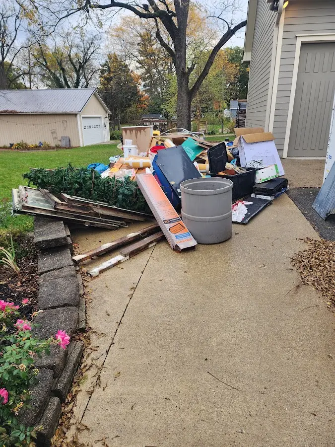 Dumpster being loaded with debris for Roofing Dumpster Rental in North Manheim